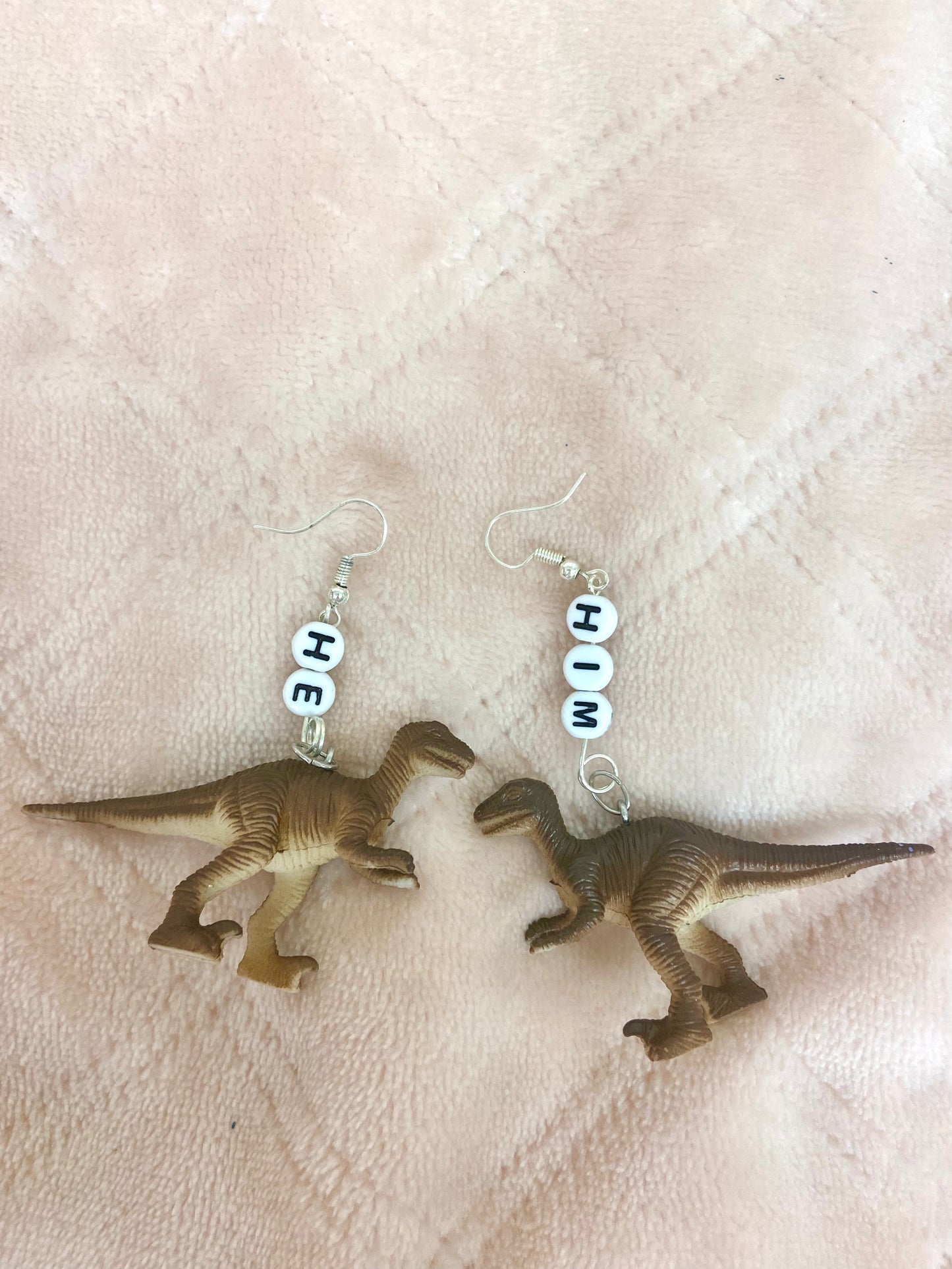 He/him critter pronoun earrings
