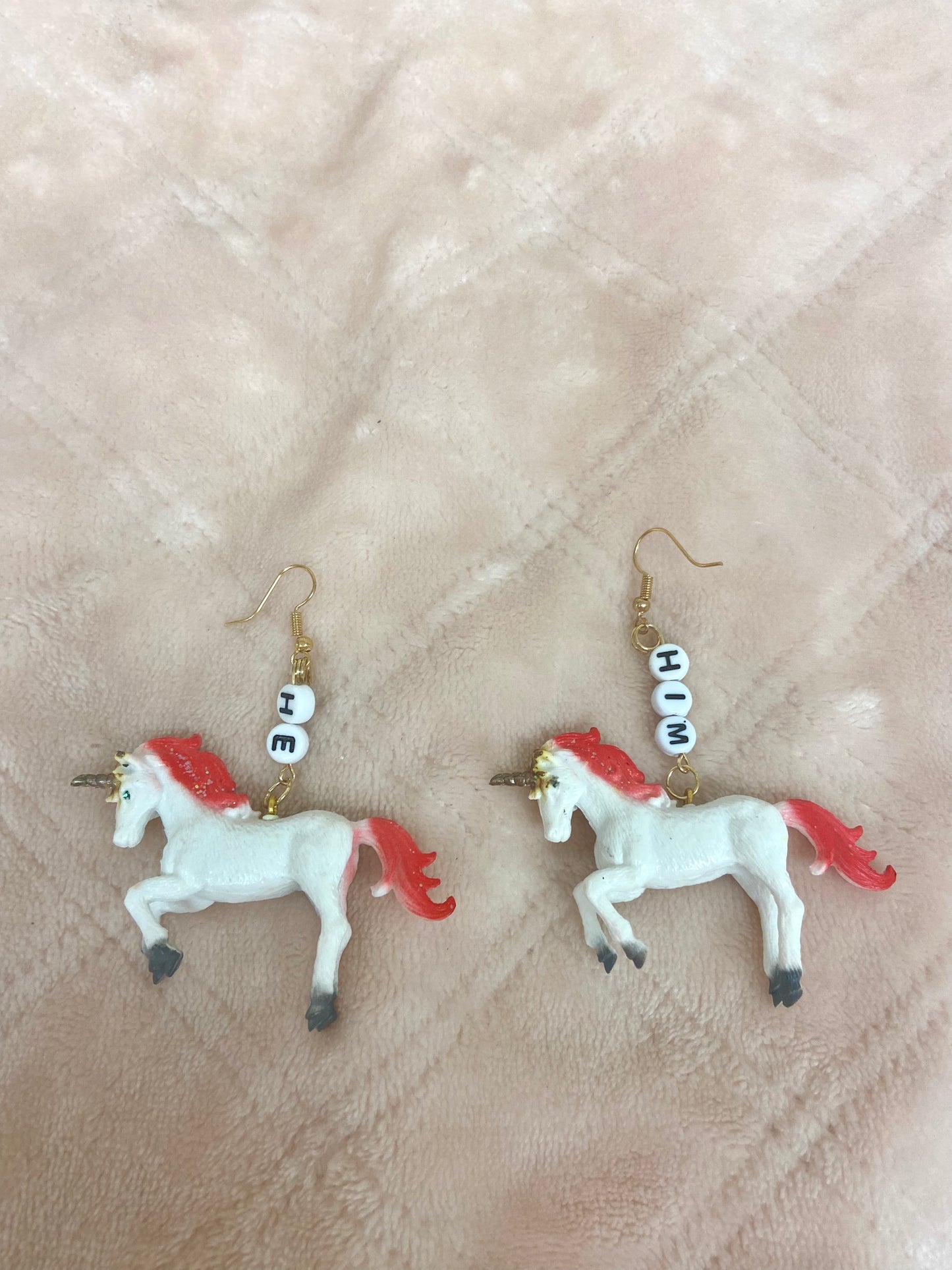 He/him critter pronoun earrings