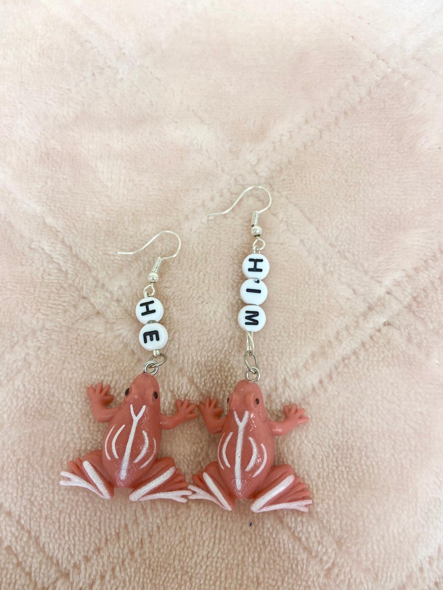 He/him critter pronoun earrings